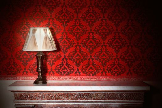 Night lamp in vintage interior with red pattern walls