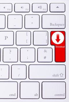 Key on keyboard with download sign and word on it written on red key. Illegal action. Torrent and p2p