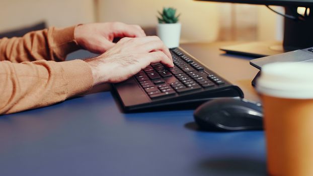 Zoom in shot of creative game developer typing on keyboard.