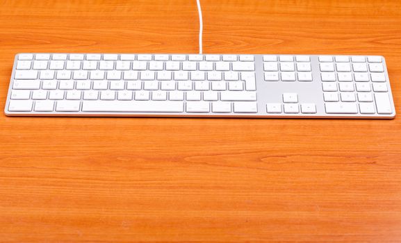 White aluminum keyboard in close up. Technology and communication