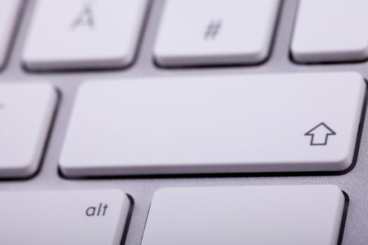 White aluminum keyboard in close up. Technology and communication