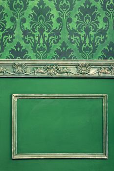 Interior on vintage room in worm green colors. Antique and retro. Rich vintage interior. House interior