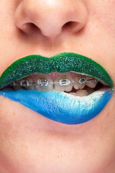 Beauty image of lips with artistic make up in studio photo