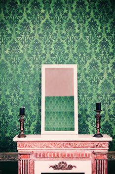 Mirror on chimney in room with vintage retro pattern wall. Retro vintage styled photo
