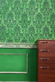 Living room with green vintage pattern. Rich retro vintage pattern on old wall