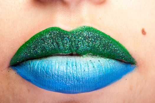 Beauty image of lips with artistic make up in studio photo
