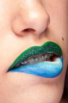 Beauty image of lips with artistic make up in studio photo