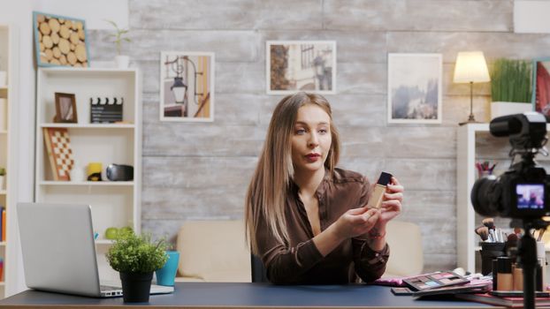 Famous beauty vlogger recording a video about skin care products. Makeup artist filming a tutorial.