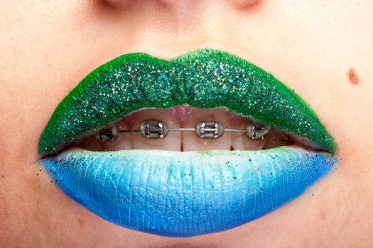 Beauty image of lips with artistic make up in studio photo