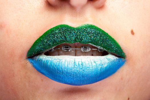 Beauty image of lips with artistic make up in studio photo