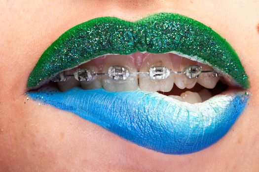 Beauty image of lips with artistic make up in studio photo