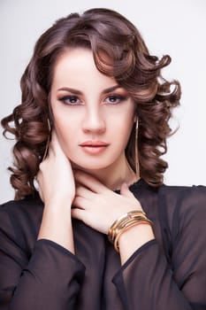 Gorgeous woman with professional make up and hairstyle. Studio shooting. Luxury