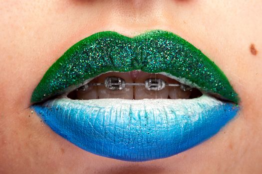 Beauty image of lips with artistic make up in studio photo