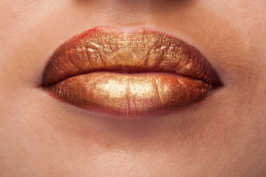 Close up of lips with lipstick on them in studio photo