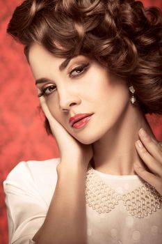 Beautiful sensual model. Toned vintage portrait. Professional make up and hairstyle. Studio shooting