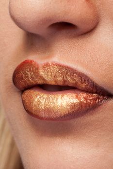 Close up of lips with lipstick on them in studio photo