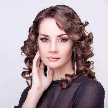 Beautiful woman with make-up studio shooting. Professional make up and hairstyle