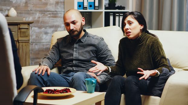 Young wife telling psychoanalyst about her relationship difficulties with her husband.