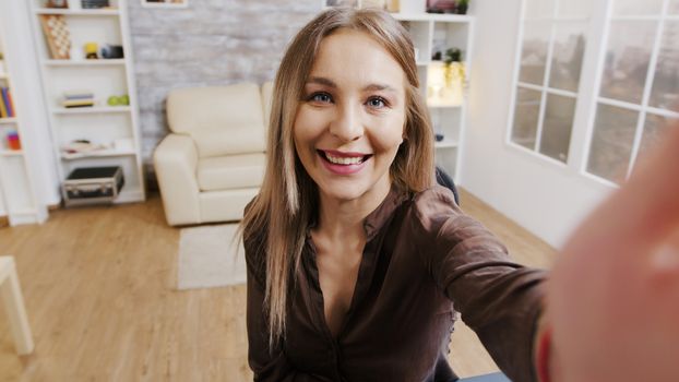 Pov shot of fashion influencer recording vlog for her subscribers. Beautiful makeup artist.