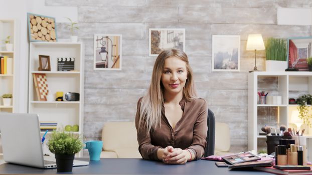 Famous beauty influencer presenting skin cosmetics on her vlog. Fashion makeup artist.
