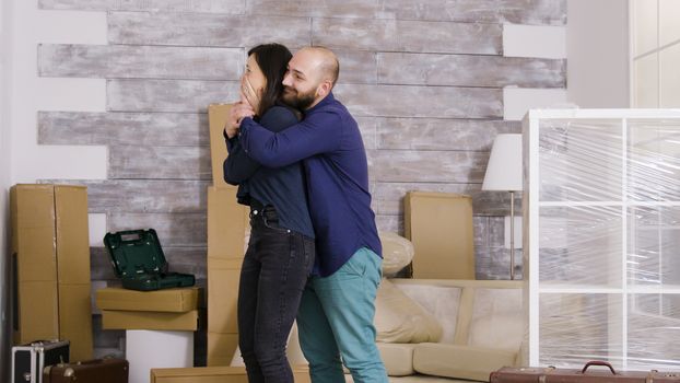 Caucasian couple excited about their new apartment. Joyful couple.