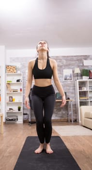 Caucasian woman jumping in the air exercise at home.