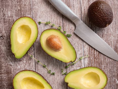 Top view of fresh cutted avocado on wooden board