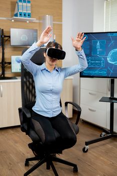 Female patient exploring virtual reality in futuristic laboratory. Vr glasses
