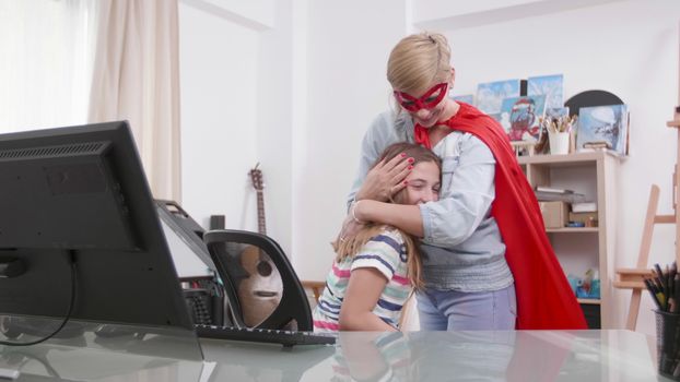 Supermom comes to help her daughter while she is having a problem. Girl gets help from a woman dressed in superhero costume.