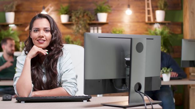 Portrait of beautiful businesswoman in casual clothes looking at the camera. Confident manager