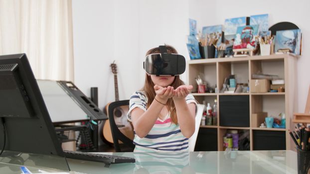 Young girl using educational software for her vr to learn new things. Using new technology to prepare for school.