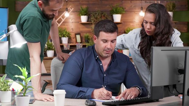 Team of office workers debating over a new product launch. Slow motion zoom in shot