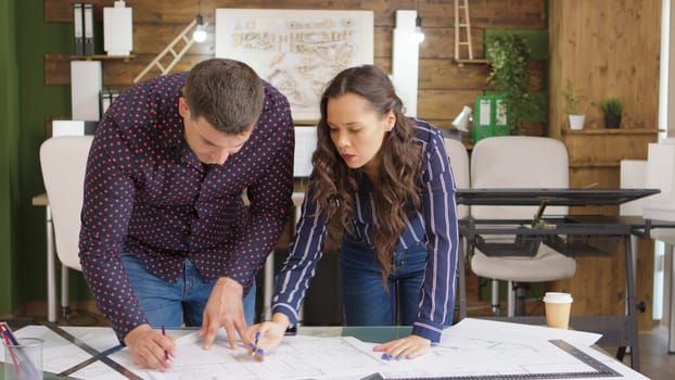 In creative agency office team of architects are working on new projects