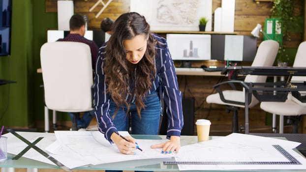 Professional creative designer working on new project in modern office