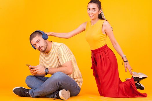 Girlfriend trying to get attention of his boyfriend because he's ignoring her.