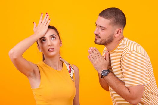 Boyfriend asking for forgiveness from his beautiful girlfriend. Relationship difficulties.