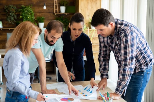 Employees discuss the latest changes in the project. Teamwork and brainstorming