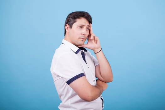 Side view portrait of young caucasian man looking concerned. Facial expression.