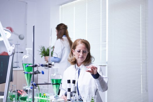 Two female scientist working in a research lab for agriculture development. Factory lab. Research lab.