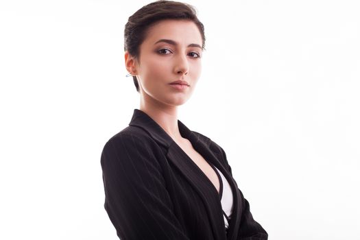 Portrait of beautiful young woman wearing a black jacket looking at the camera over white background. Stylish girl.
