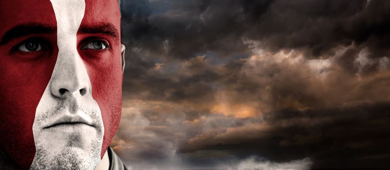 Georgia rugby player against blue and orange sky with clouds