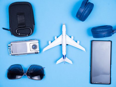 Flat lay traveler photographer ready for summer vacation. Sunglasses. Headphones.