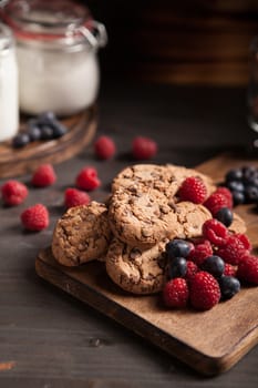 Close up photo of delicious dessert over a wooden plate. Sweet chocolate chips.