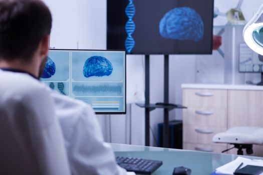 Modern technology used by young and successful doctor in a hospital laboratory