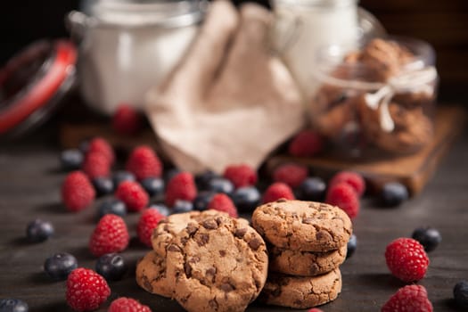 Tasty biscuits baked with dark chocolate for breakfast with milk. Healthy breakfast.