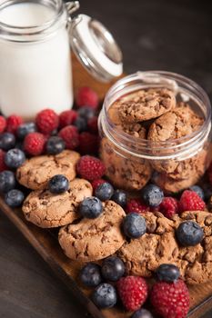 Close up photo of delicious chocolate oatmeal cookies with bluebarries. Delicious dessert.