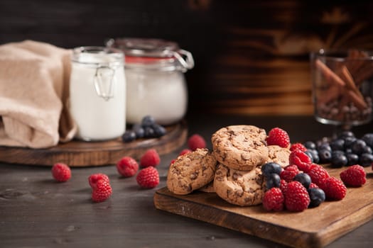 Healthy and delicious chocolate biscuits freshly baked. Biscuits and raspberries.