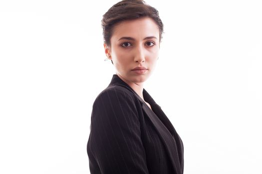Side view portrait of beautiful young girl wearing a black jacket over white background. Girl in her 20s.