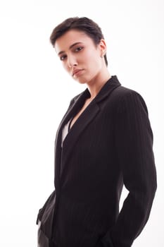Charming young woman in studdio over white background wearing a black jacket. Casual clothes.