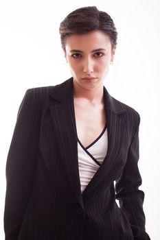 Young female with short hair wearing a stylish jacket in studio over white background. Gorgeous young female.
